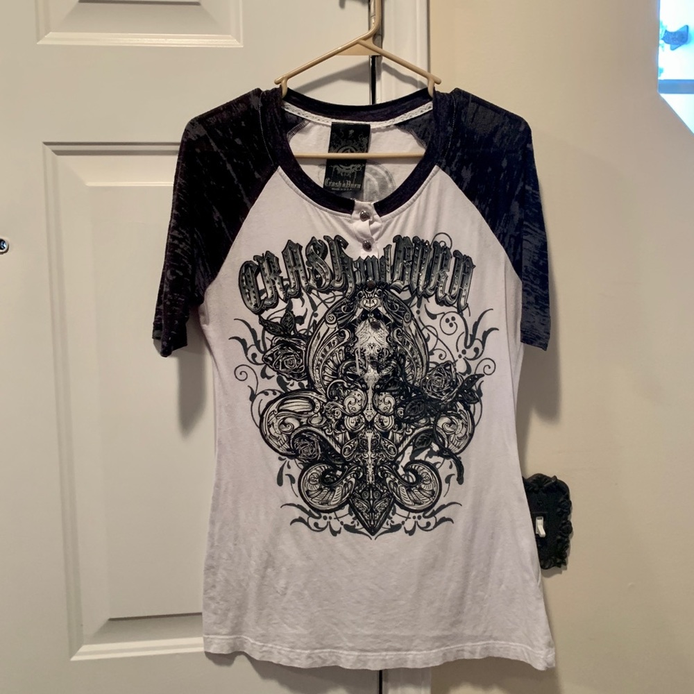 Cool jersey with emblem and shiny grommets on front & back. From Buckle store.